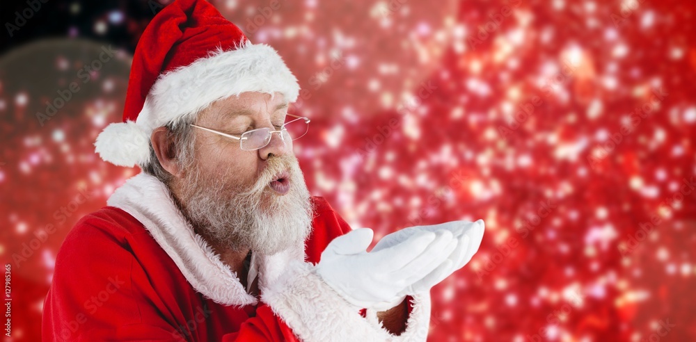 戴眼镜的圣诞老人吹隐形眼镜的合成图像