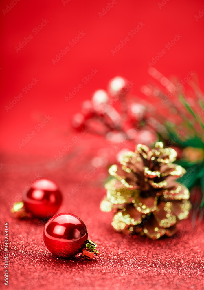 Christmas holiday concept. Red balls with star and branch tree on background. Bokeh.