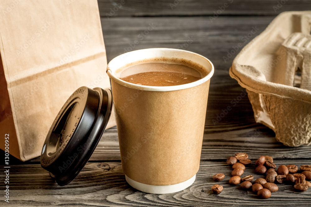 coffee cup to go at wooden background