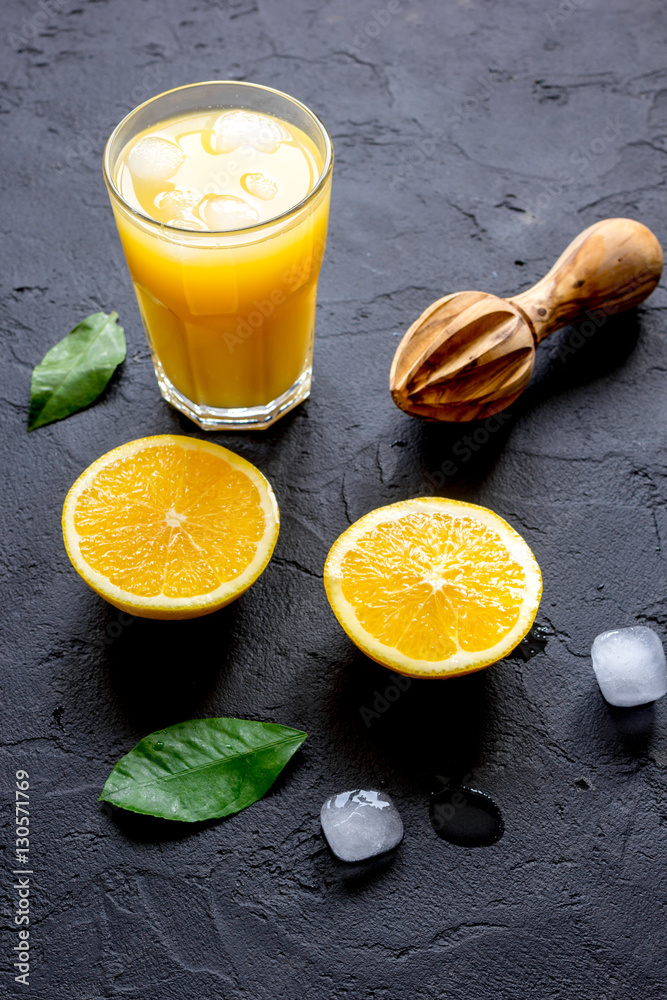 freshly squeezed orange juice on dark background