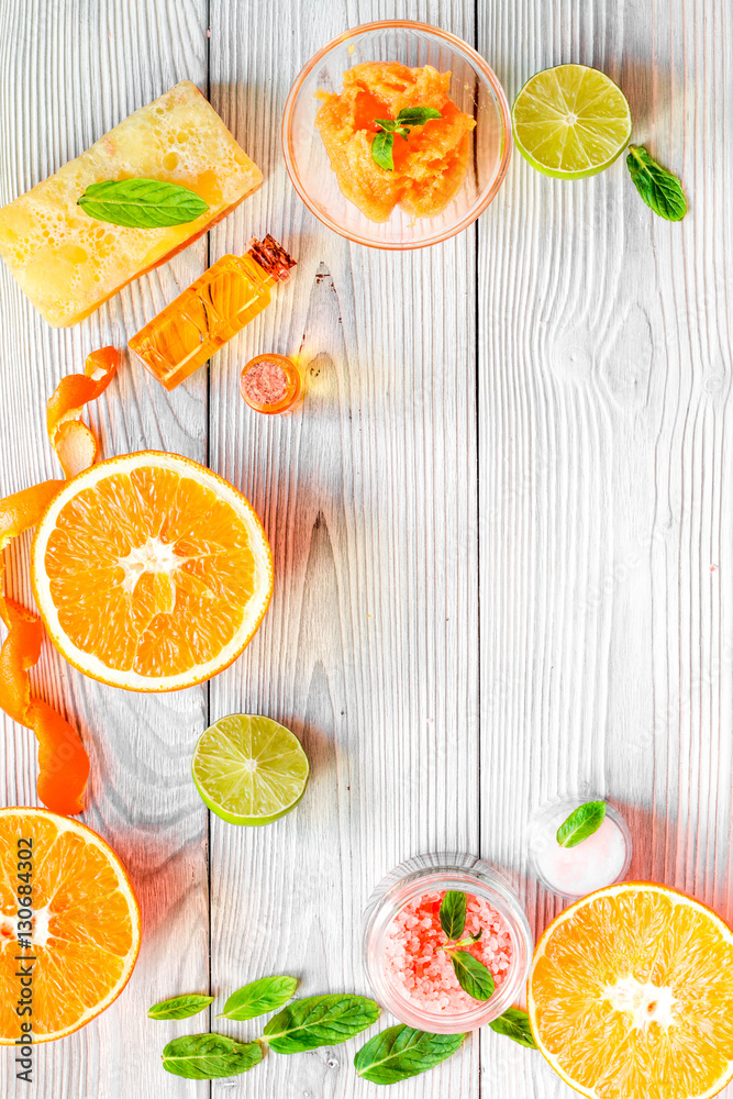 organic cosmetic with citrus on wooden background top view