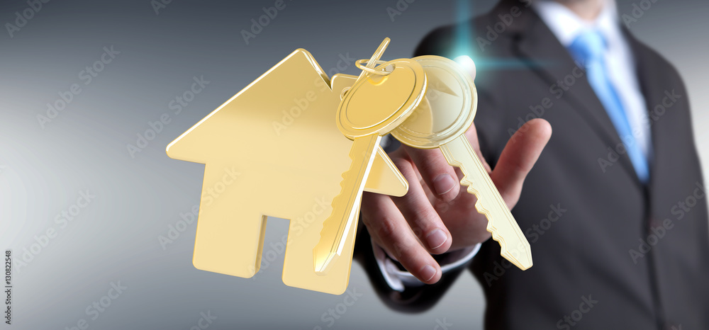 Businessman touching key with house keyring in his finger 3D ren