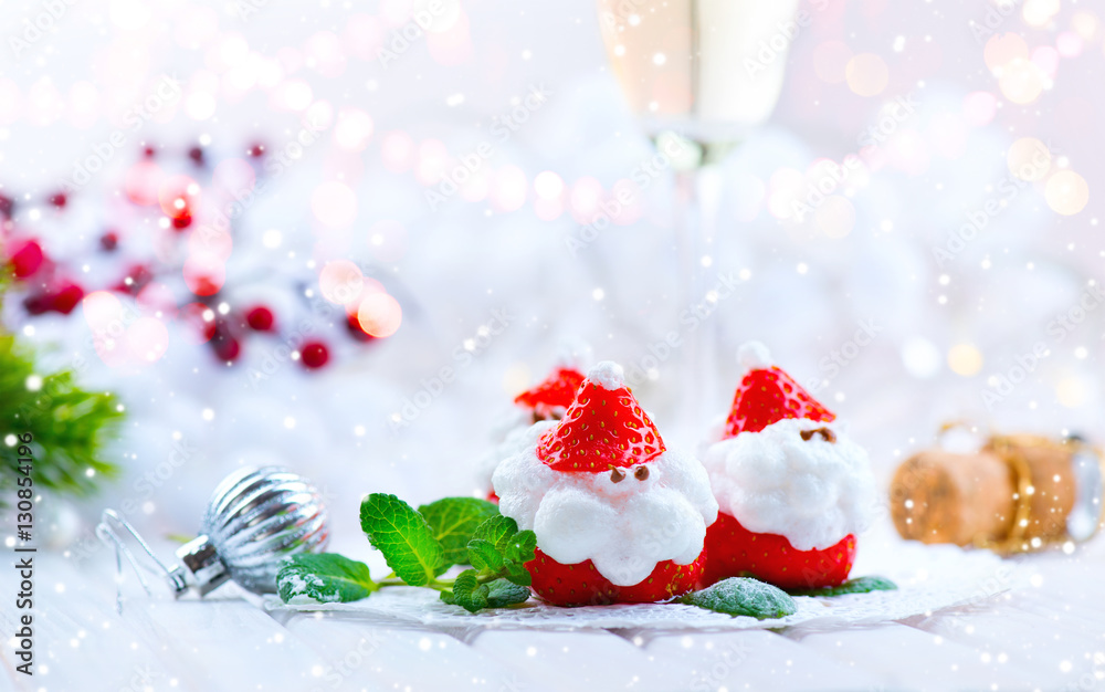 Christmas strawberry Santa. Funny dessert stuffed with whipped cream. Xmas party food idea