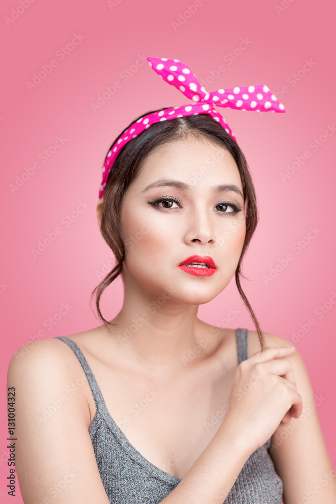 Portrait of beautiful pinup asian woman with vintage makeup and
