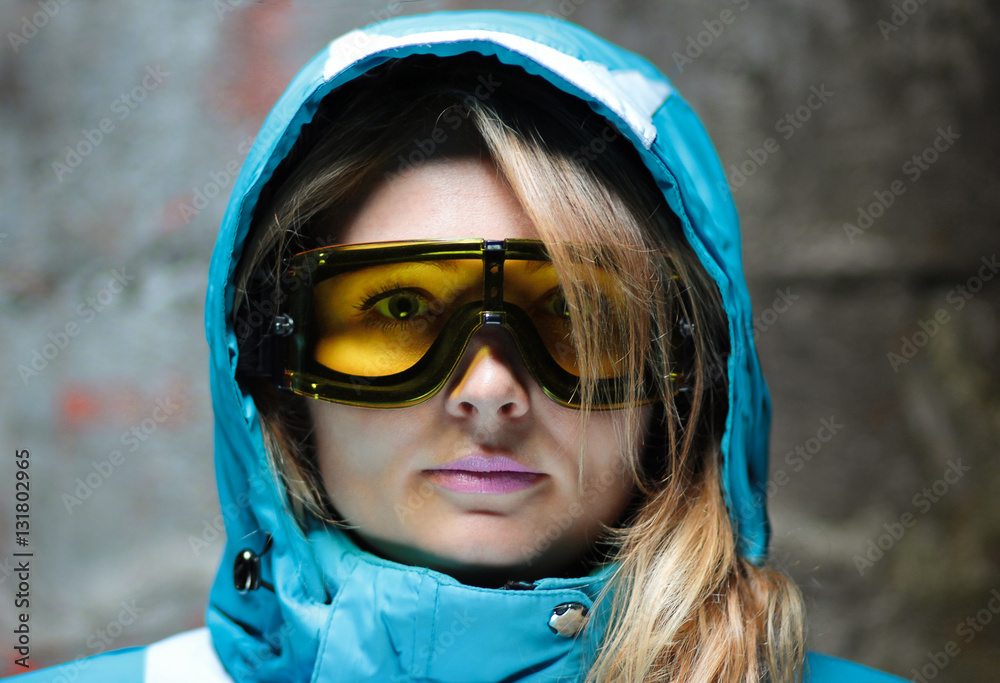 beautiful girl in snowboard mask and ski jacket