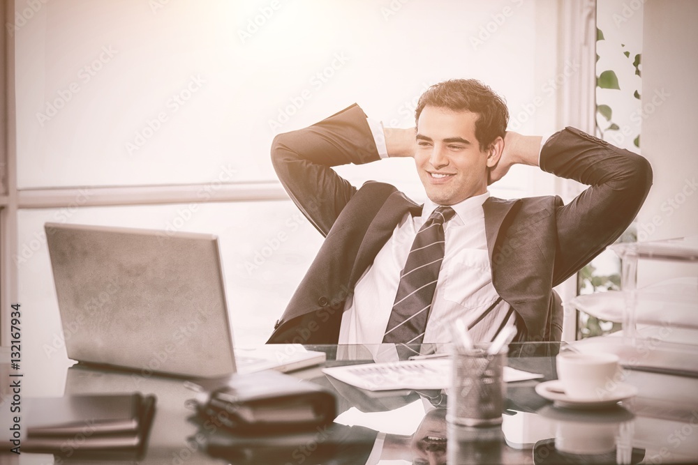 Relaxed businessman working with a laptop