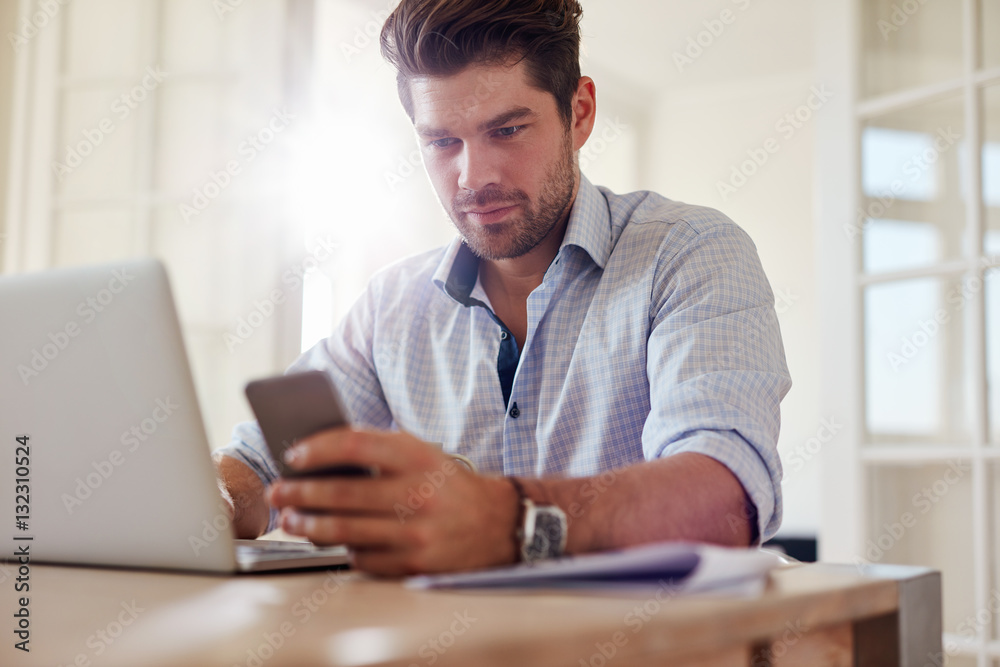 Young man working from home office
