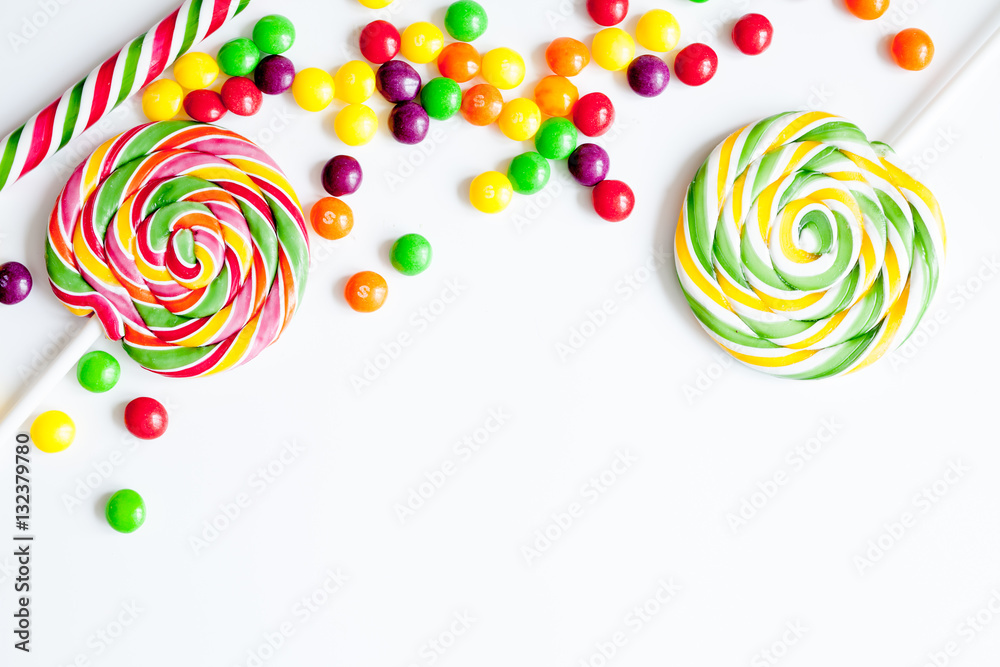 sweets and sugar candies on white background top view
