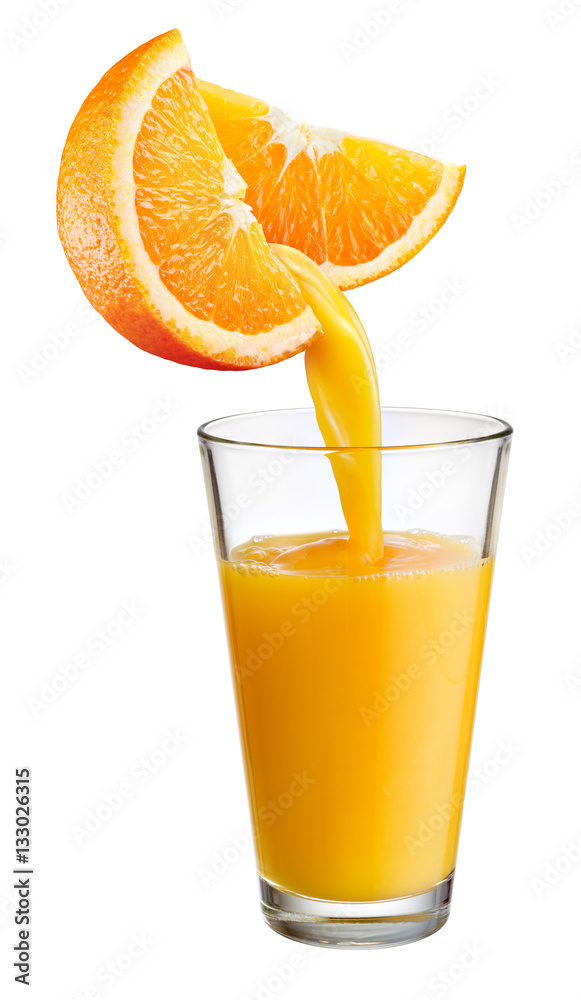 Fresh juice pours from orange fruit into the glass isolated on w