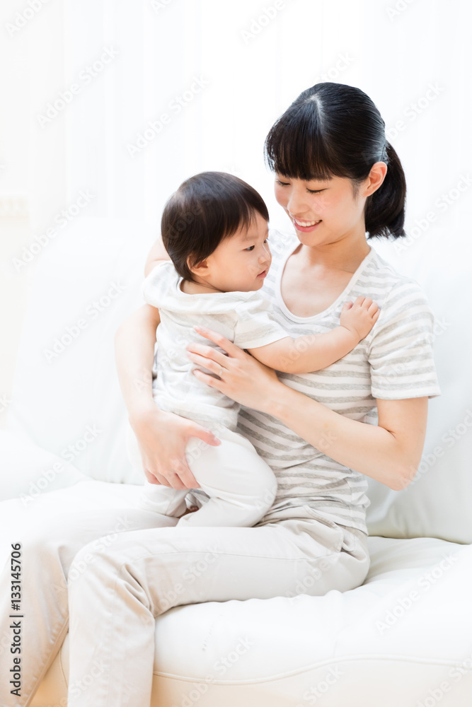 portrait of asian baby and mother relaxing
