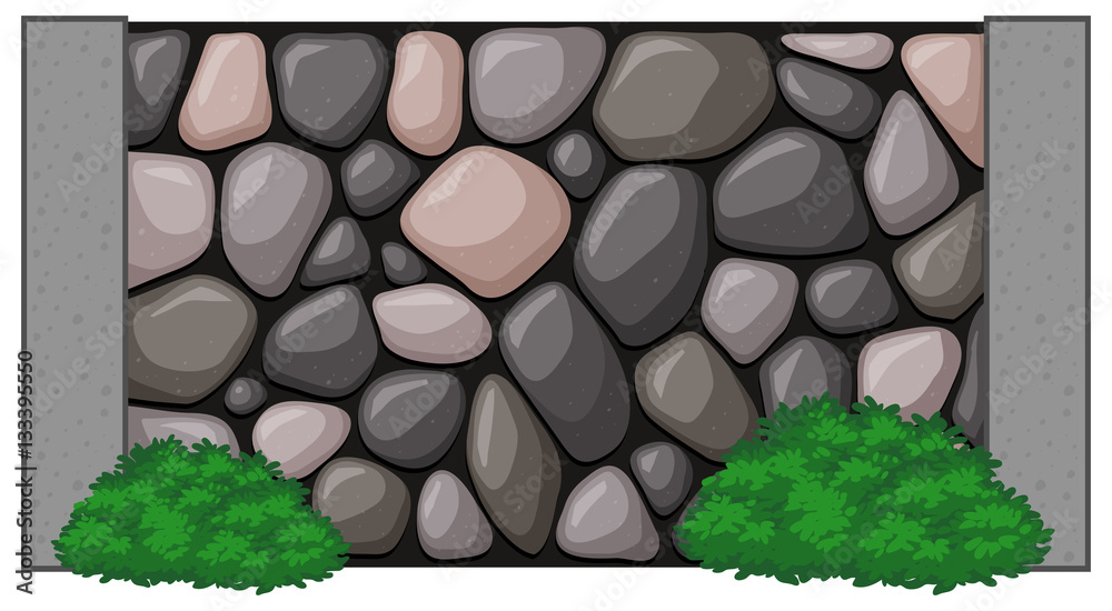 Stone wall with green bush