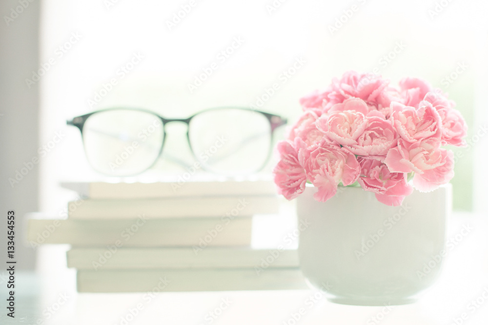 the Fresh pink carnation flower in white mug cup