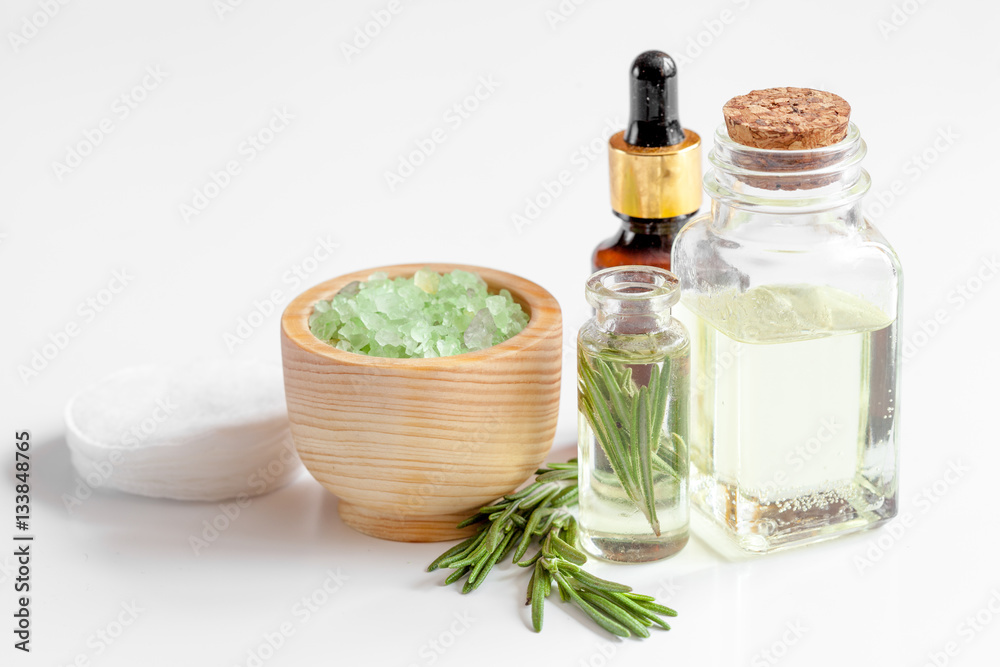 organic cosmetics with extracts of herbs rosemary on white background