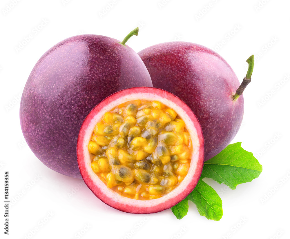 Isolated maracuya. Two whole passion fruits and a half isolated on white background with clipping pa