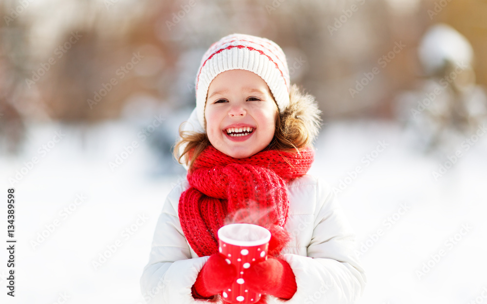 happy child girl with tea on winter.