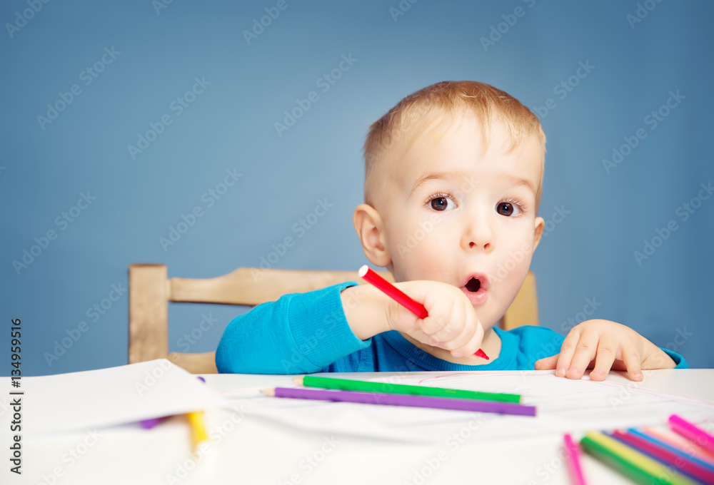 Little child drawing on the paper