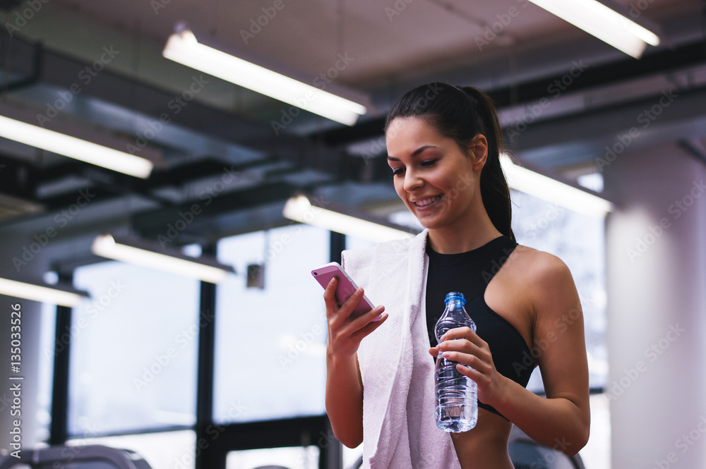 Portrait of personal trainer woman at gym after fitness workout