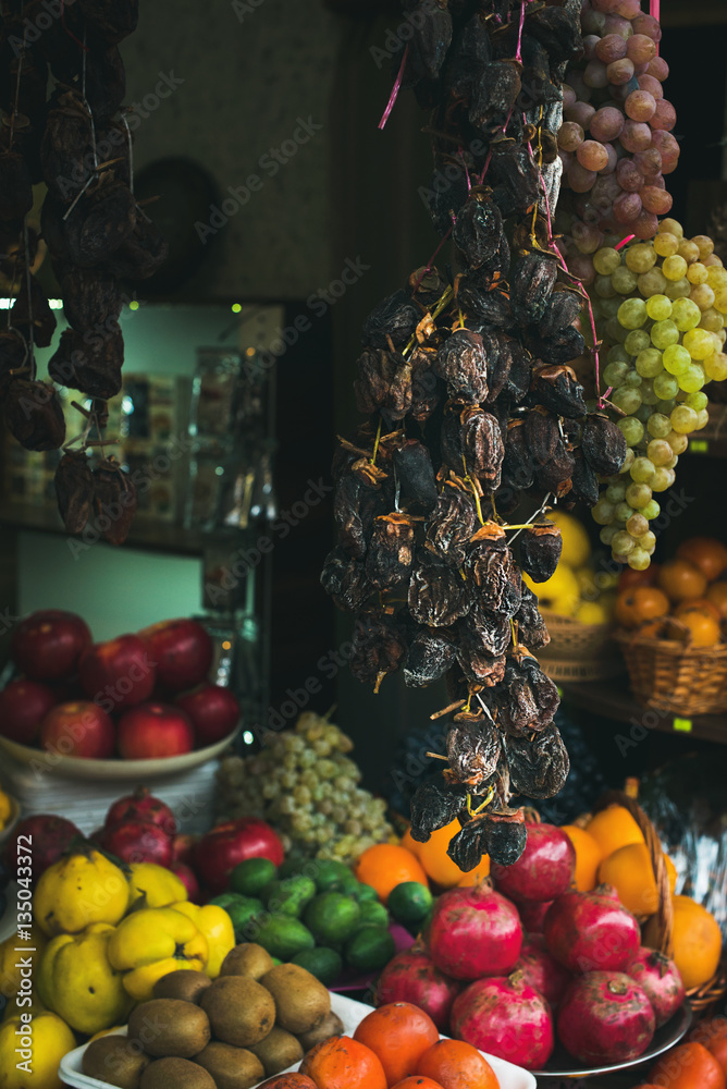 Small grocery store window with fresh and dried fruit and vegetables in old center of Tbilisi, Georg