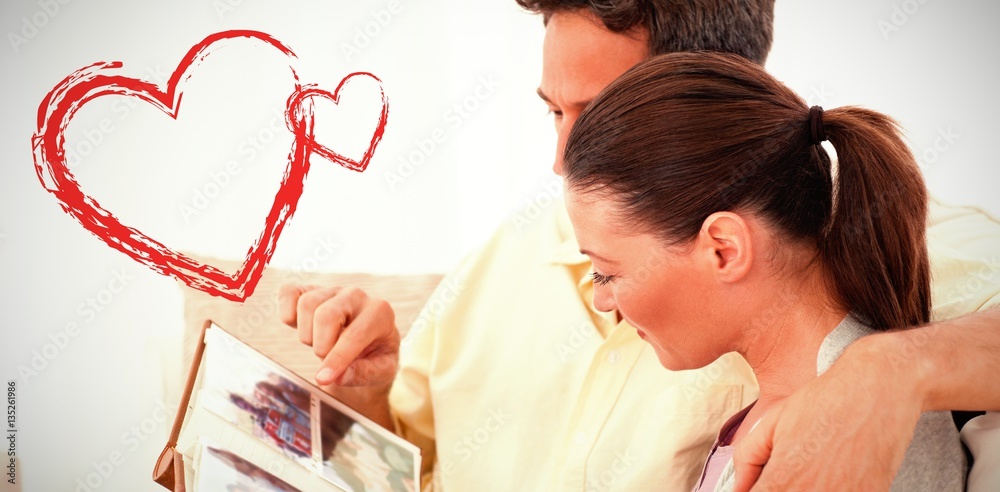 side view of lovely couple looking at pictures