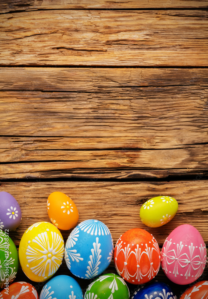 Easter eggs placed on wooden board