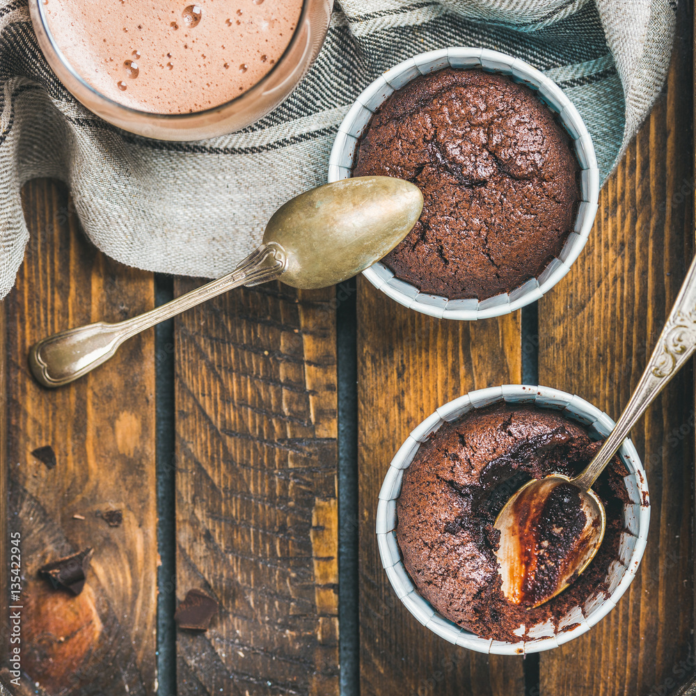 Chocolate souffle in individual baking cups and chocolate mocha coffee in wooden serving tray, top v
