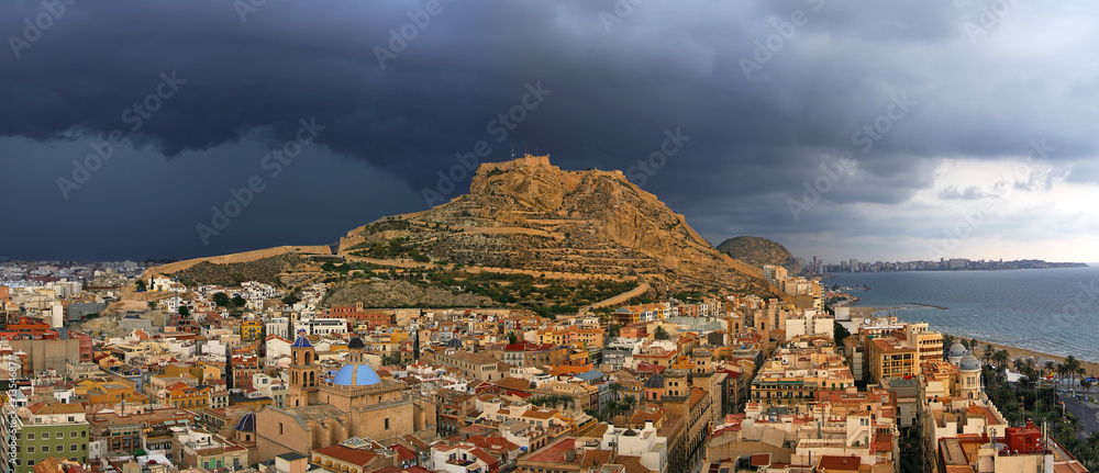 Alicante city and Castillo de Santa Barbara before storm, Spain