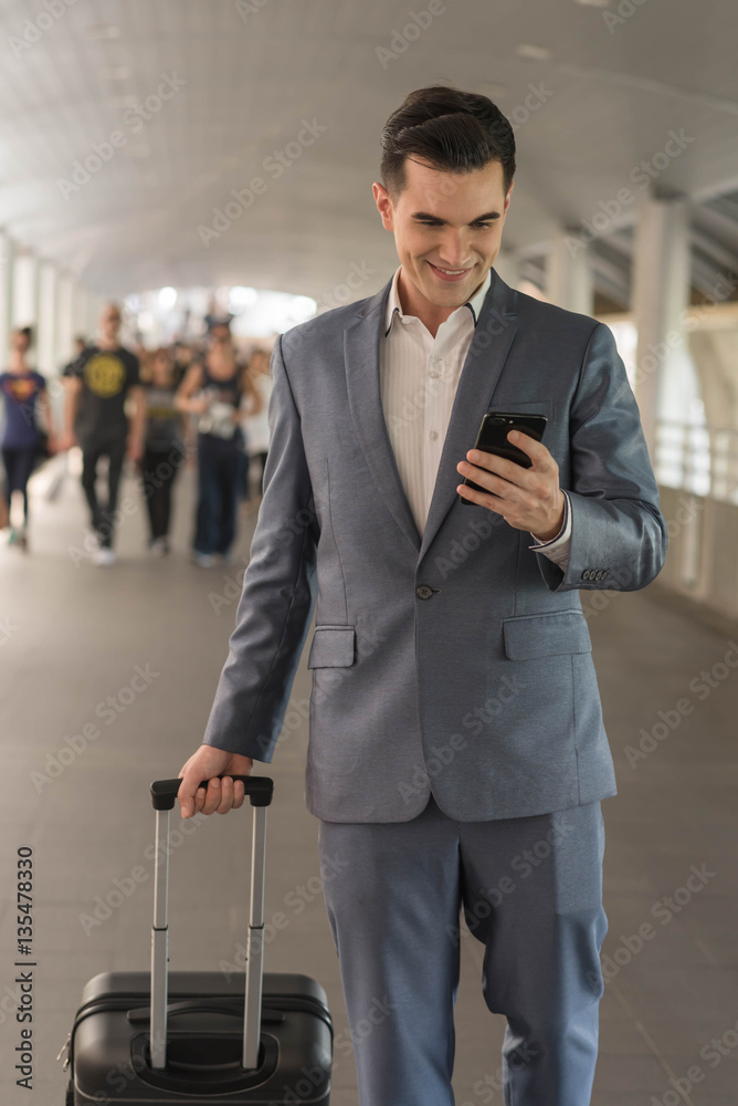 Westerner Business man talking via smart phone on the walk way w