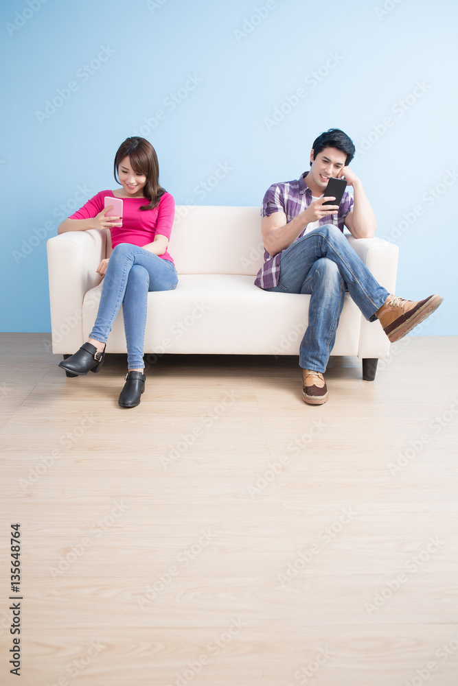 young couple play phone happily