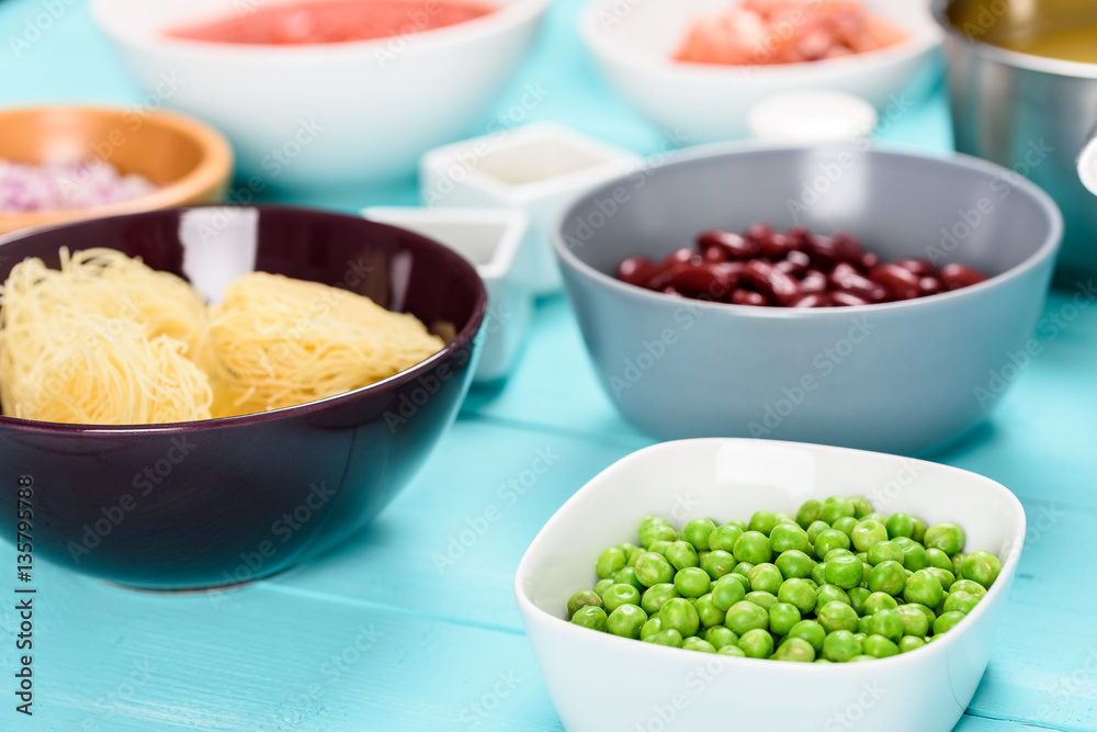 Green Peas And Food Ingredients On Turquoise Kitchen Table