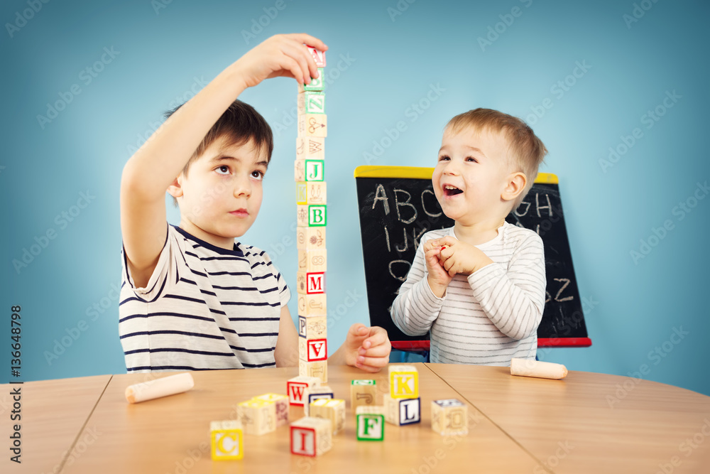 Children playing with cubes on the table
