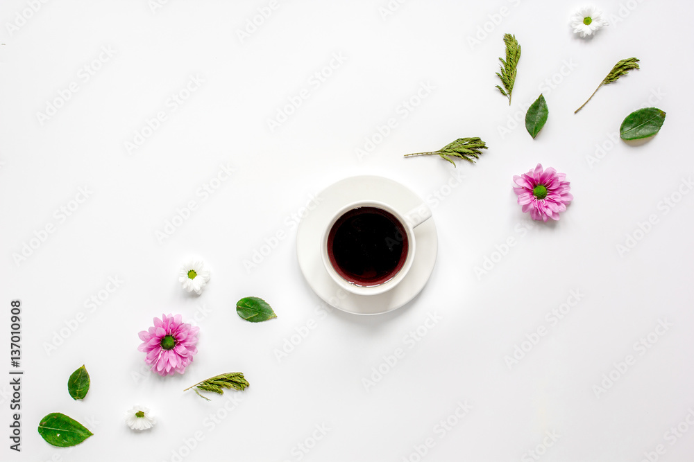 Petals and coffee cup on table background top view mock up