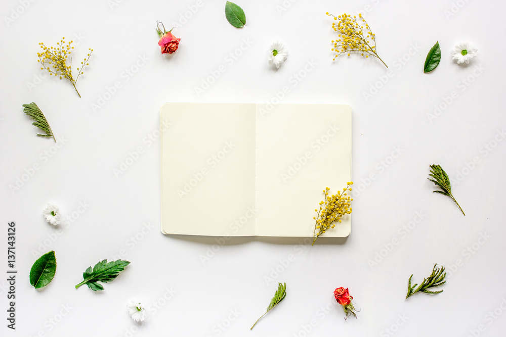 Flat lay with petals and copybook top view mock up