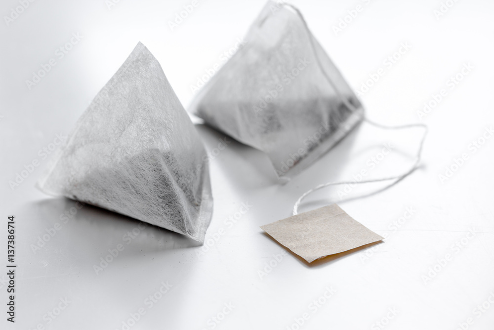 Pyramid teabags on white table mock-up