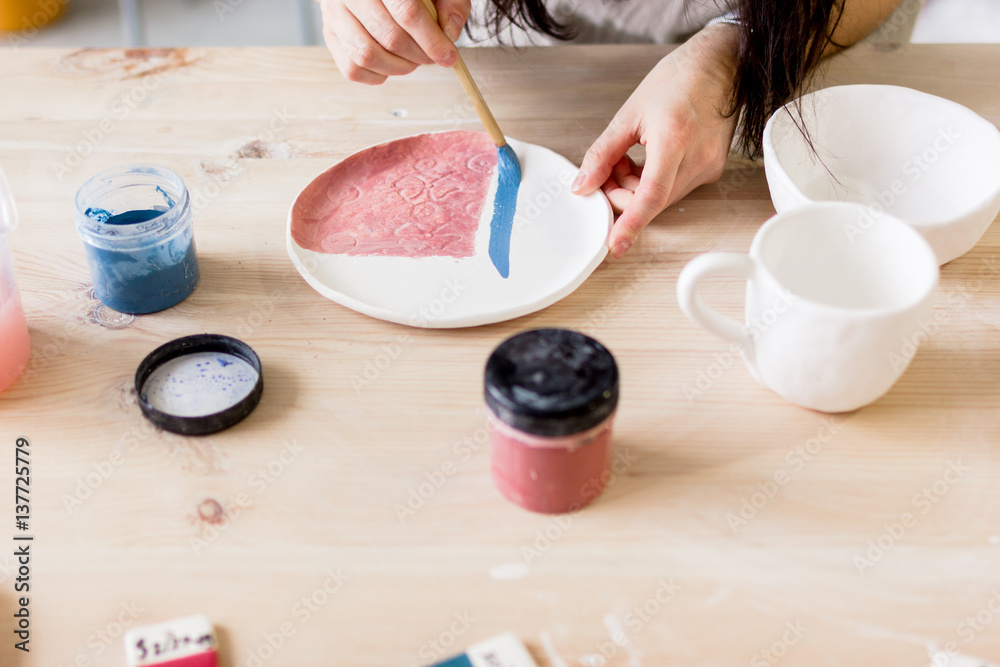 workshop production of ceramic tableware product painting