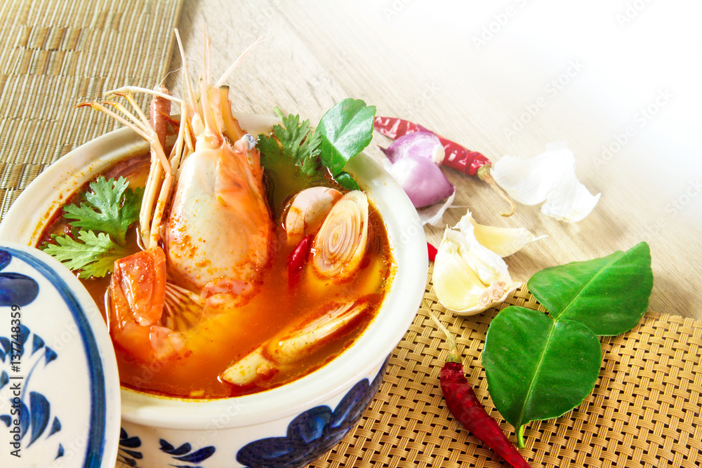 Close up Asian Spicy soup with shrimp in  bowl , famous Thai food cuisine calling Tom Yum Kung