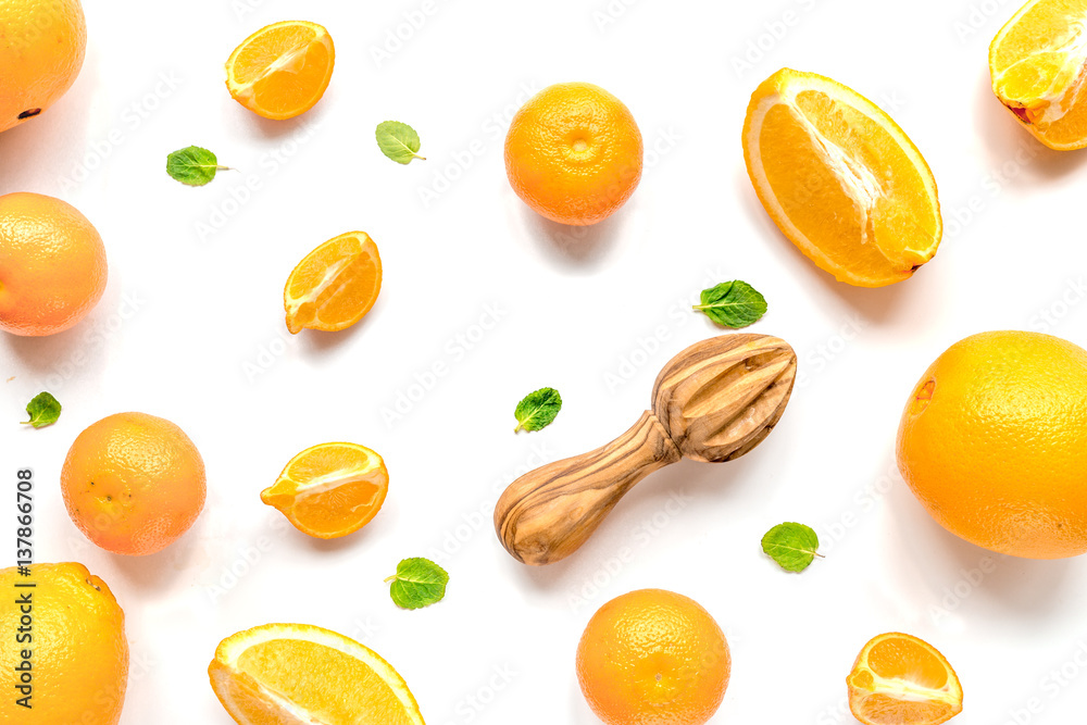 Cut oranges for juicy breakfast on white background top view pattern