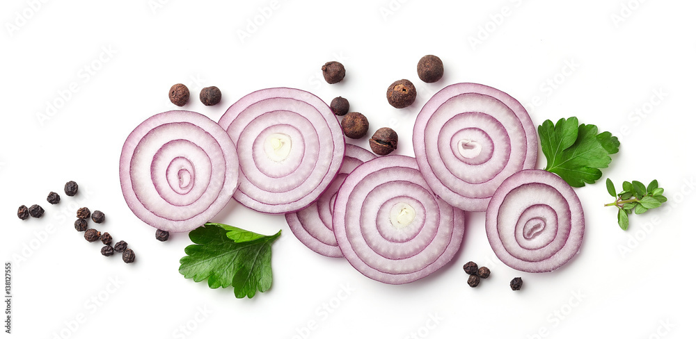 red onion and various spices on white background