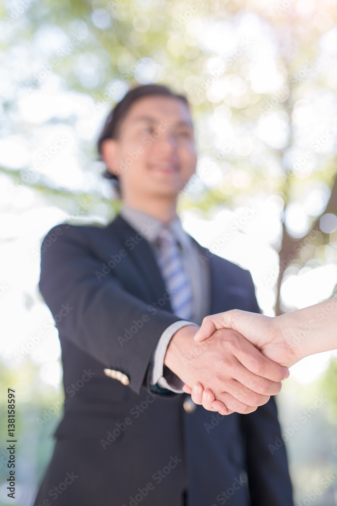 businessman shake hand in outdoor