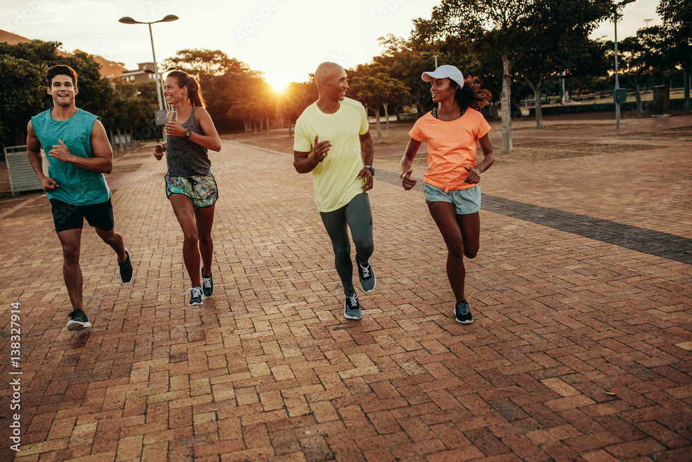 Runners training outdoors in evening