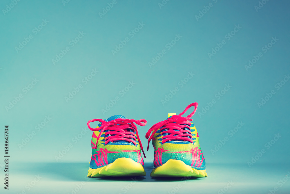 Colorful running sneakers on a blue background