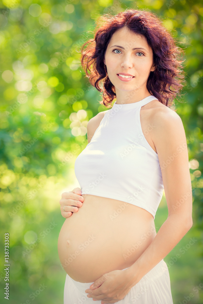Beautiful belly of young pregnant woman