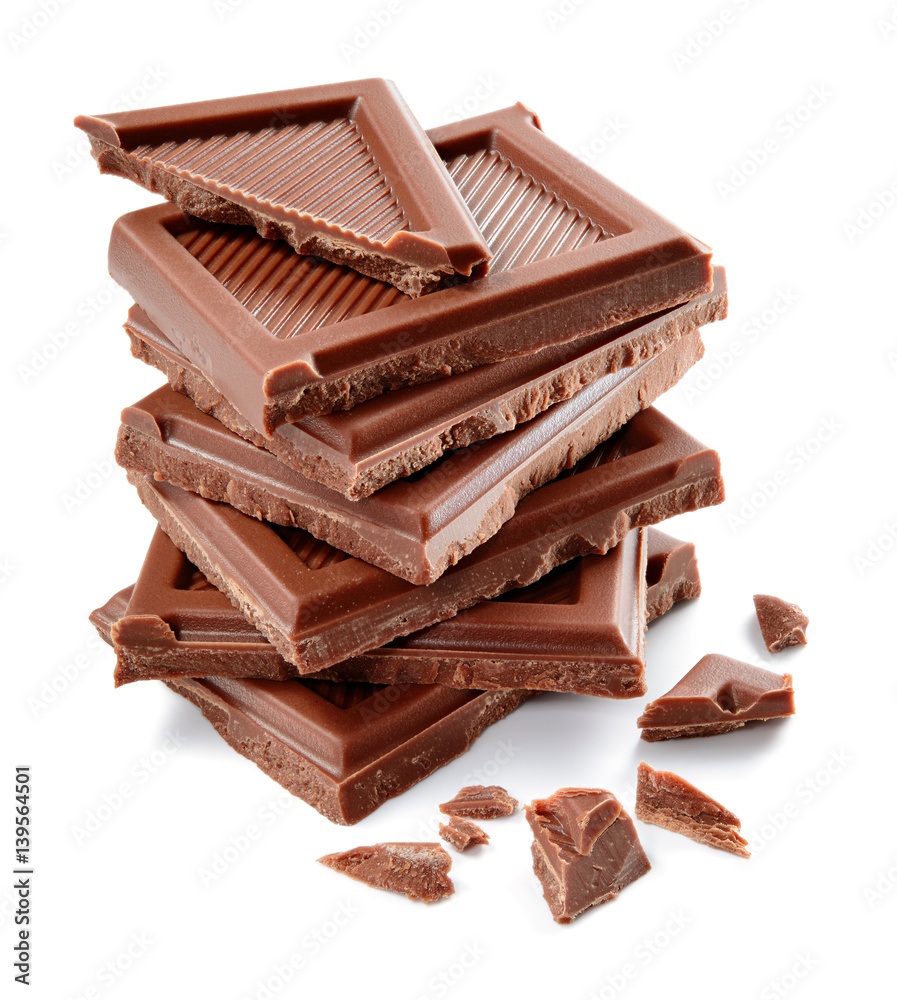 Chocolate bar. Broken pieces isolated on white background. Organic food.