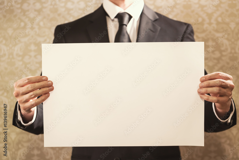 Businessman holding a sign board