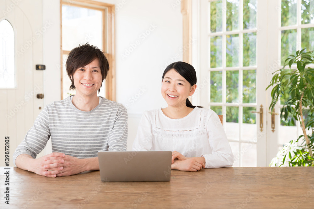 young asian couple using laptop computer