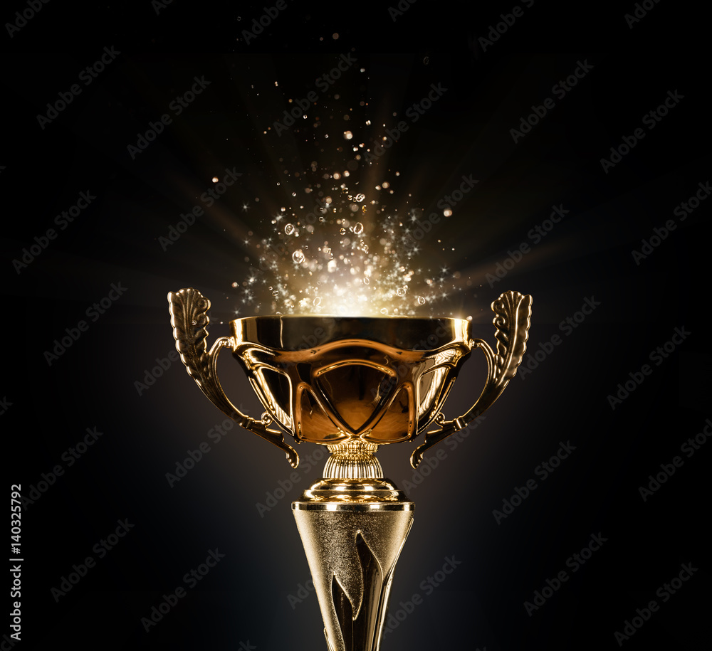 Champion golden trophy on black background