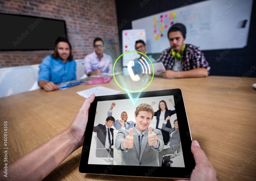 Man having a video with his colleagues on digital tablet