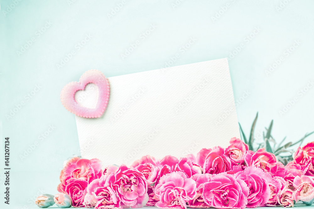 beautiful blooming carnation flowers  with empty white card