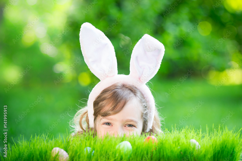 Easter bunny and eggs on green grass