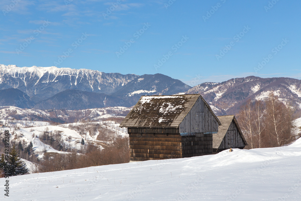 Winter in Transylvania (Romania) Old traditional countryside house in winter
