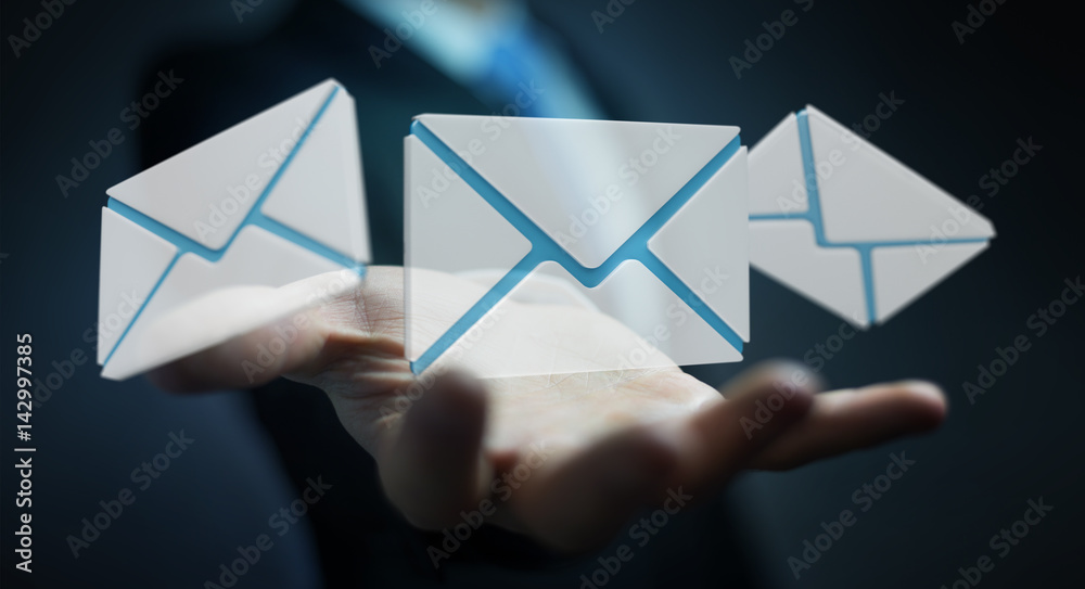 Businessman holding 3D rendering flying email icon in his hand